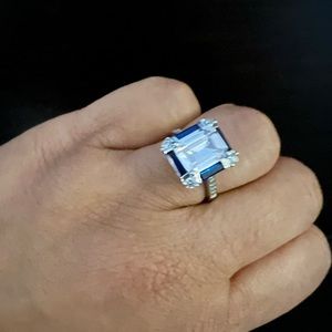 silver.   white sapphire rectangle cut.   size 6 or 6.5.  i am not sure size